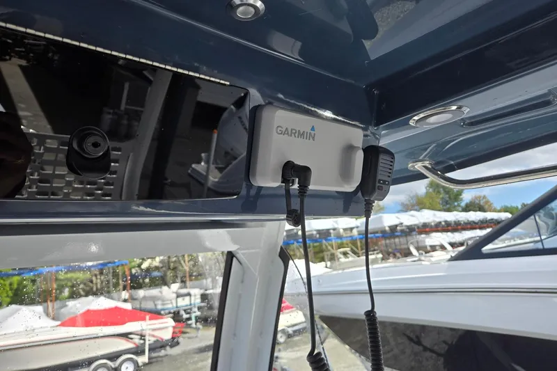 Slide: The Image of 2026 Hurricane Center Console 24 OB with Garmin device installed on the dashboard. - 23