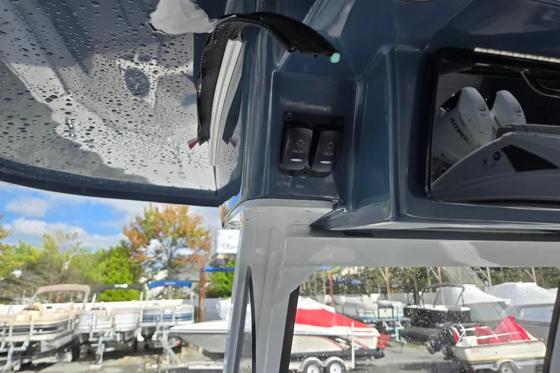 Slide: The Image of 2026 Hurricane Center Console 24 OB boat interior with switches and wet surfaces. - 24