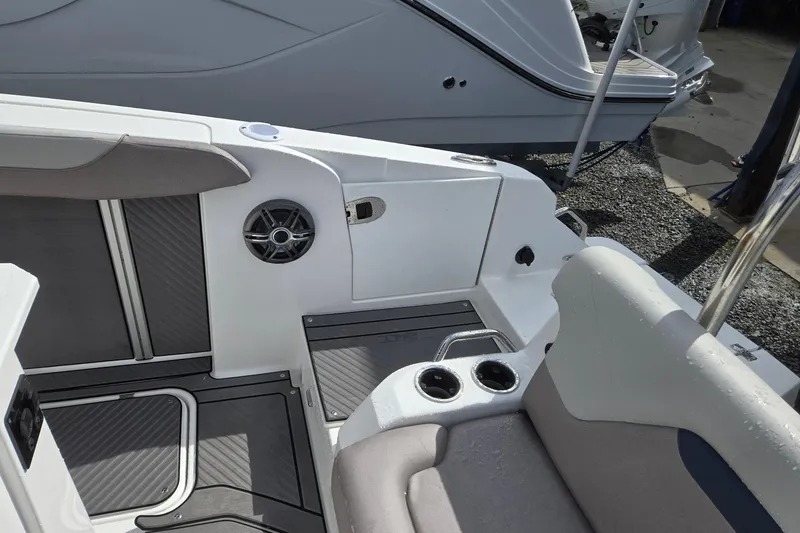 Slide: The Image of 2026 Hurricane Center Console 24 OB boat interior with seating and cup holders. - 28