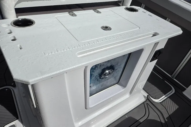 Slide: The Image of 2026 Hurricane Center Console 24 OB boat with wet deck and storage compartment. - 29