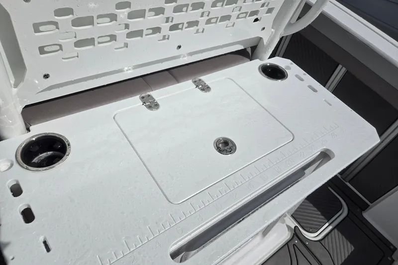 Slide: The Image of 2026 Hurricane Center Console 24 OB boat with a white fishing station and cup holders. - 30