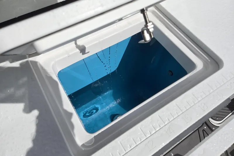 Slide: The Image of Open storage compartment on 2026 Hurricane Center Console 24 OB boat. - 31
