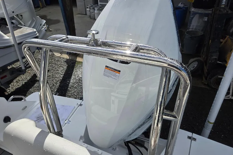 Slide: The Image of 2026 Hurricane Center Console 24 OB boat with sleek design and stainless steel railings. - 32