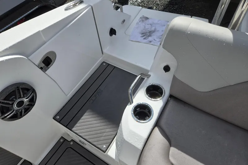 Slide: The Image of 2026 Hurricane Center Console 24 OB boat interior with cup holders and speaker. - 34