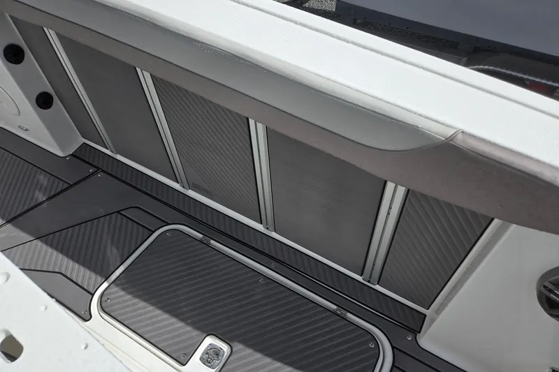 Slide: The Image of 2026 Hurricane Center Console 24 OB boat interior with sleek, modern design and storage compartment. - 35