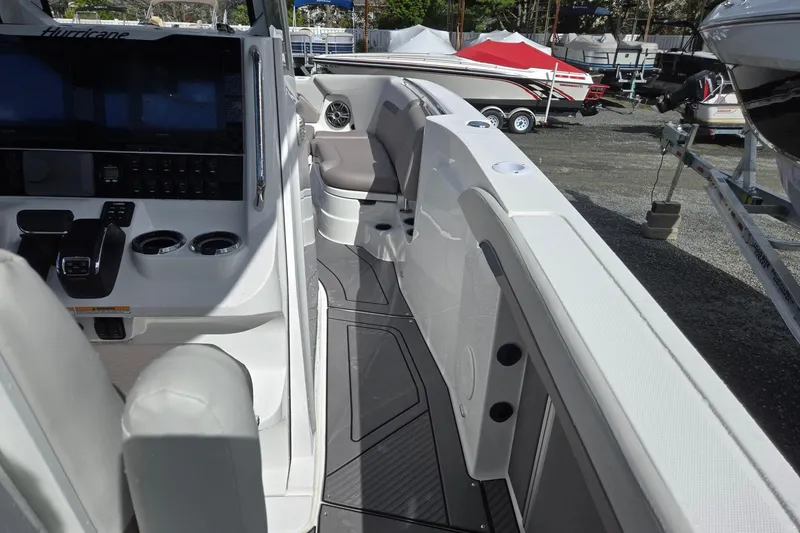 Slide: The Image of 2026 Hurricane Center Console 24 OB boat interior with modern controls and seating. - 36