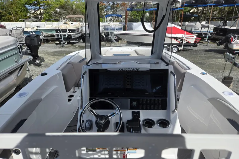 Slide: The Image of 2026 Hurricane Center Console 24 OB boat interior with steering wheel and control panel. - 37