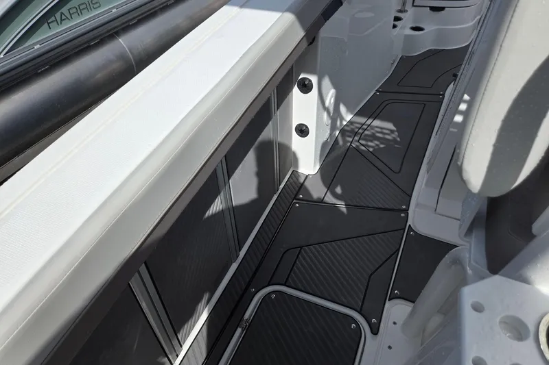 Slide: The Image of 2026 Hurricane Center Console 24 OB boat interior with sleek black flooring and modern design. - 38