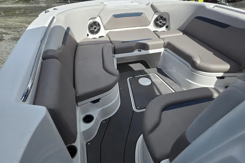 Slide: The Image of 2026 Hurricane Center Console 24 OB boat interior with gray seating and speakers. - 41