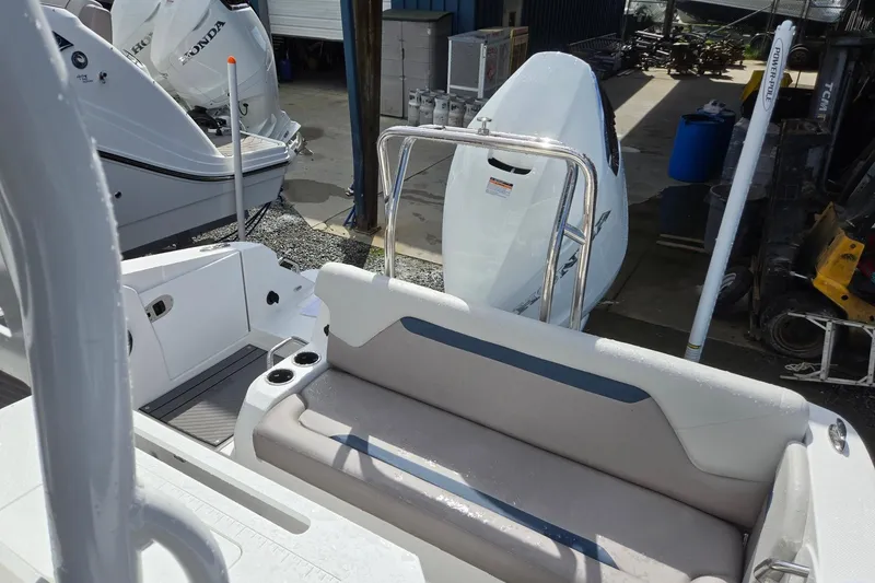 Slide: The Image of 2026 Hurricane Center Console 24 OB boat interior with seating and outboard motor. - 42