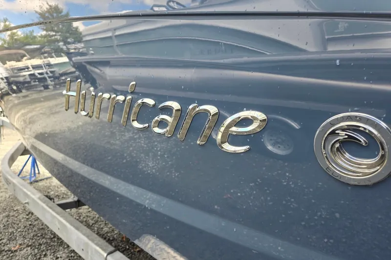 Slide: The Image of 2026 Hurricane Center Console 24 OB boat logo on sleek hull. - 44