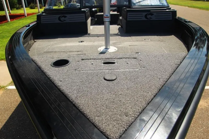 Slide: The Image of 2022 Crestliner 2100 Raptor boat deck with carpeted surface and fishing seat mount. - 2