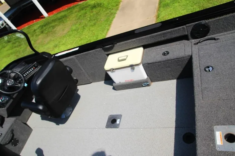 Slide: The Image of 2022 Crestliner 2100 Raptor boat interior with seating and storage compartments. - 6