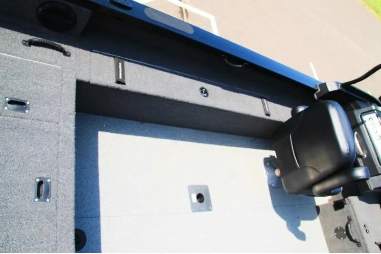 Slide: The Image of 2022 Crestliner 2100 Raptor interior with seating and storage compartments. - 7