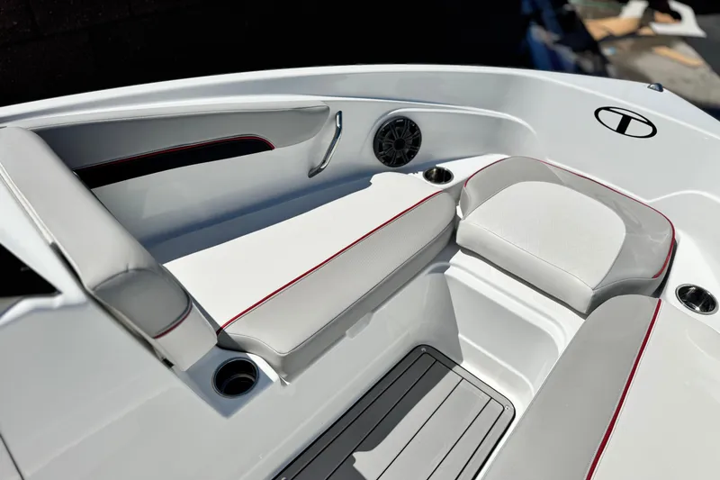 Slide: The Image of Interior of 2021 Tahoe T700 boat with white seating and red accents. - 11