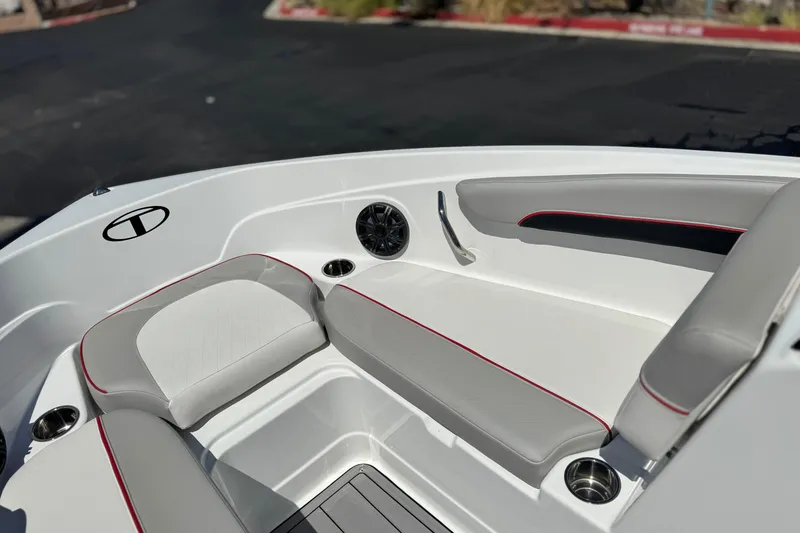 Slide: The Image of 2021 Tahoe T700 boat interior with cushioned seating and cup holders. - 12