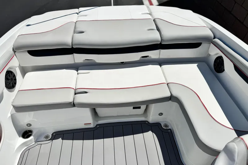 Slide: The Image of Luxury seating area on a 2021 Tahoe T700 boat with sleek design and red accents. - 14