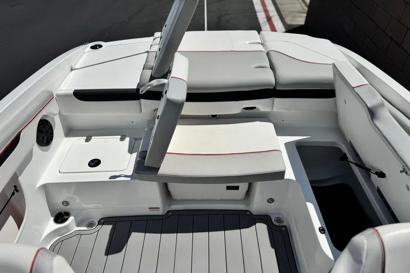 Slide: The Image of 2021 Tahoe T700 boat interior with cushioned seating and storage compartments. - 15