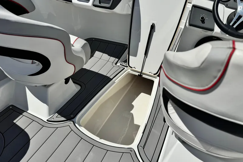 Slide: The Image of 2021 Tahoe T700 boat interior with open storage compartment and seating. - 21