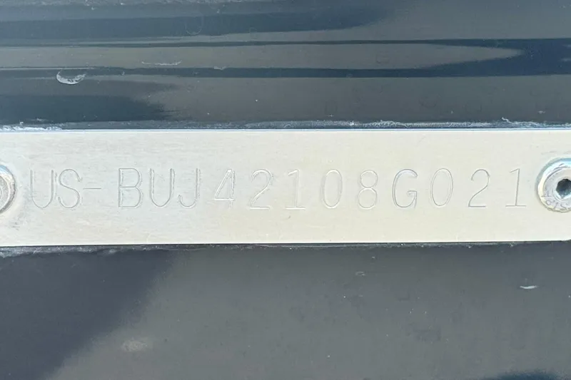 Slide: The Image of VIN plate on a 2021 Tahoe T700, displaying serial number US-BUJ42108G021. - 28