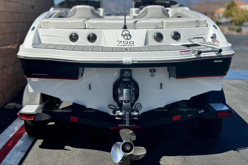 Slide: The Image of 2021 Tahoe T700 boat rear view with outboard motor and trailer. - 4