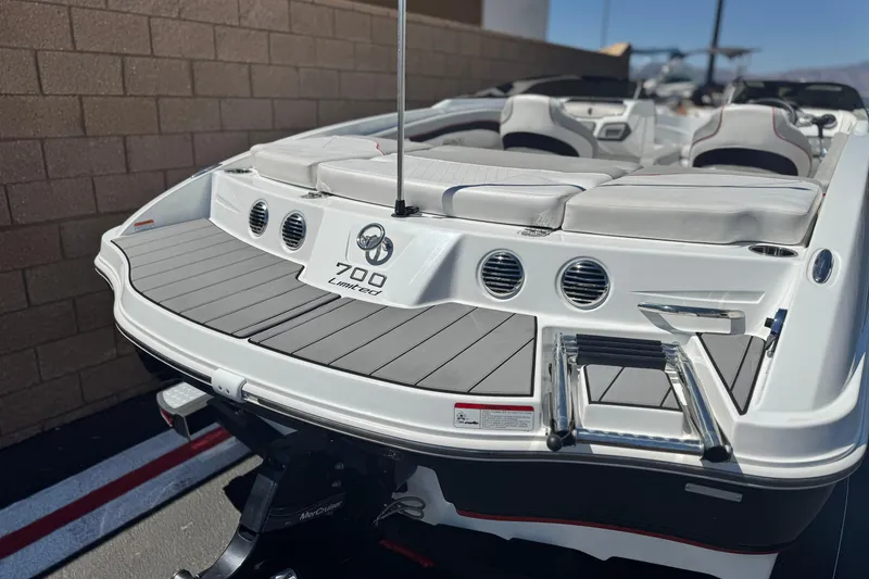 Slide: The Image of 2021 Tahoe T700 boat rear view with seating and swim platform. - 6