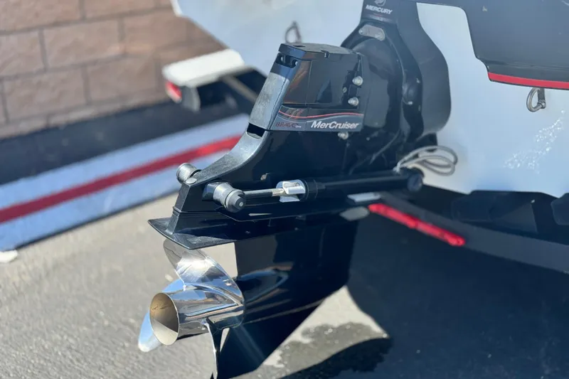 Slide: The Image of 2021 Tahoe T700 boat with MerCruiser engine and propeller detail. - 7