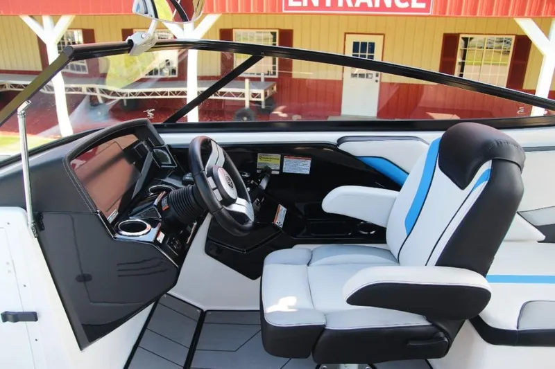 Slide: The Image of 2019 Yamaha Boats 242X cockpit with modern steering and comfortable seating. - 10