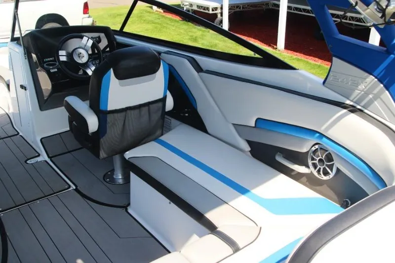 Slide: The Image of 2019 Yamaha Boats 242X interior with sleek seating and modern steering wheel design. - 12