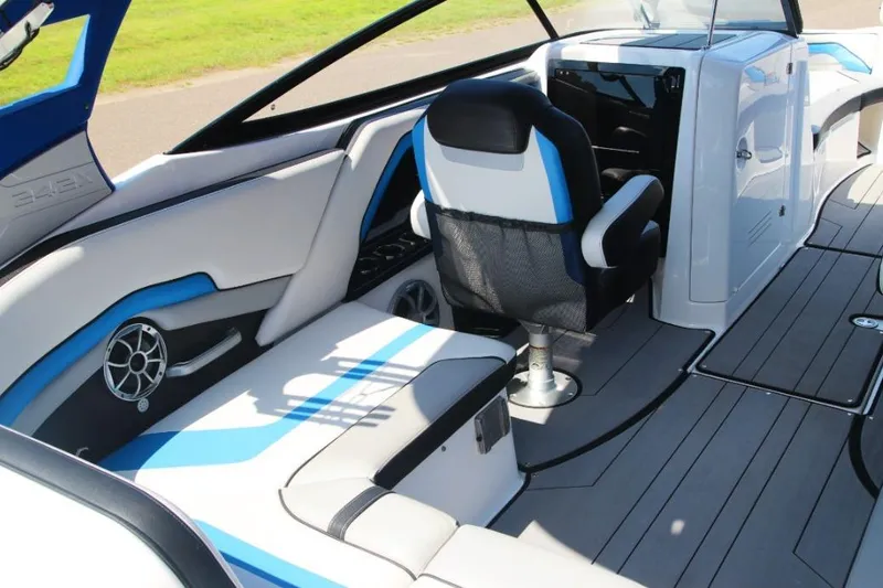 Slide: The Image of 2019 Yamaha Boats 242X interior with sleek seating and modern dashboard design. - 13
