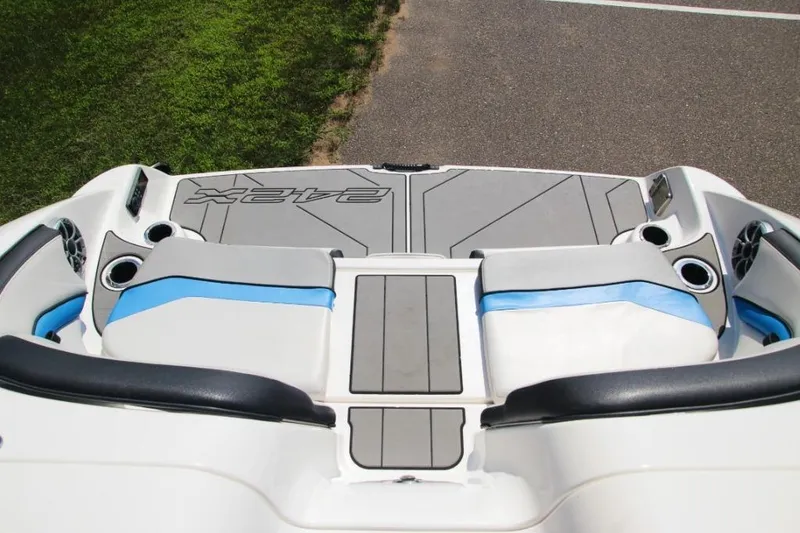 Slide: The Image of 2019 Yamaha Boats 242X rear seating area with cup holders and speakers. - 5