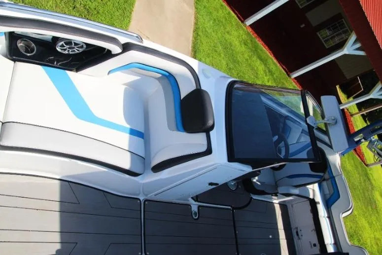 Slide: The Image of 2019 Yamaha Boats 242X interior with sleek seating and modern design. - 9