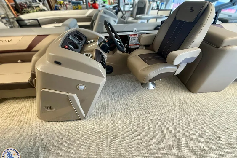 Slide: The Image of 2025 Bennington 22 SXSR boat interior with captain's chair and control panel. - 3