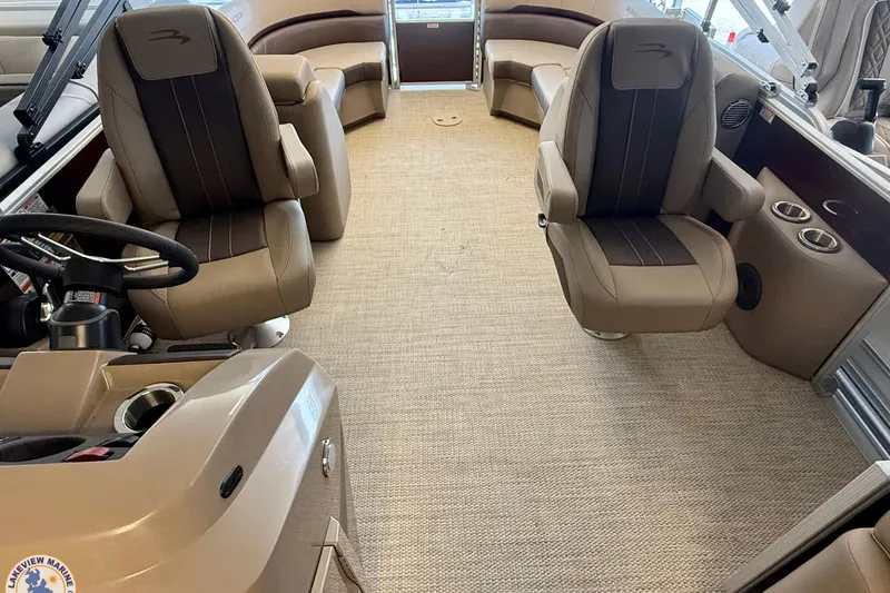 Slide: The Image of 2025 Bennington 22 SXSR boat interior with plush seating and modern helm. - 4