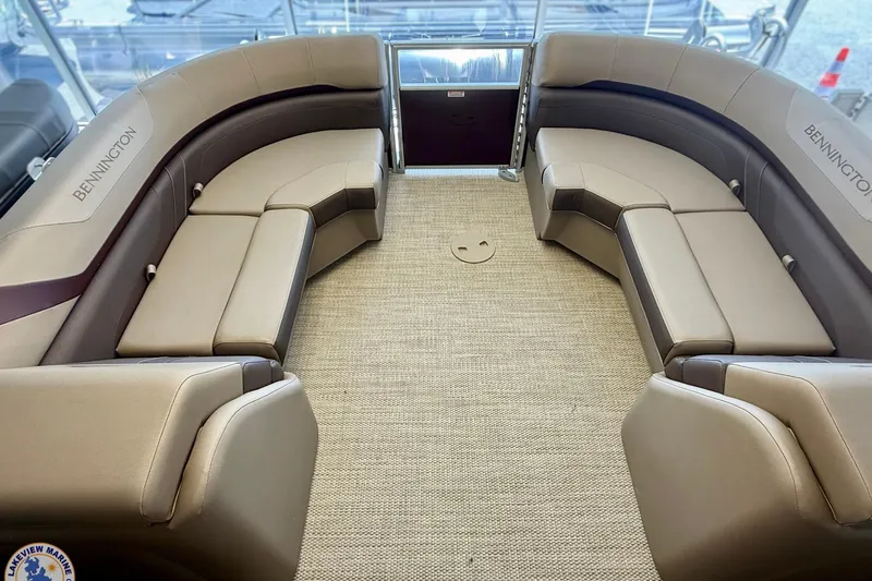 Slide: The Image of 2025 Bennington 22 SXSR boat interior with luxurious seating and carpeted flooring. - 6