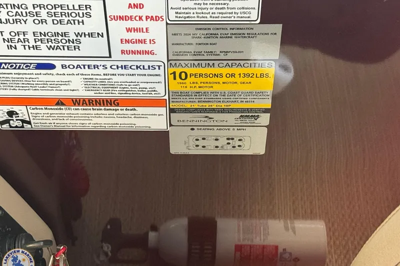 Slide: The Image of 2025 Bennington 22 SXSR capacity and safety labels, including warnings and maximum load information. - 8