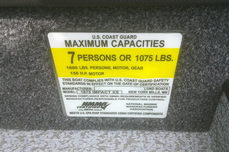 Slide: The Image of Capacity label for 2026 Lund 1875 Impact XS Sport, 7 persons or 1075 lbs. - 12