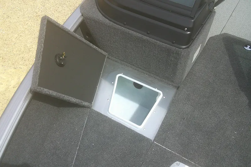 Slide: The Image of 2026 Lund 1875 Impact XS Sport boat with open storage compartment. - 8