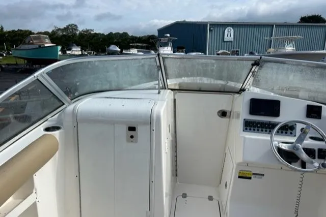Slide: The Image of 2019 Key West 239 DFS boat interior with steering wheel and control panel. - 11