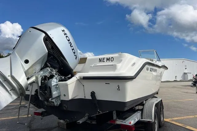 Slide: The Image of 2019 Key West 239 DFS boat on trailer with Honda outboard motor. - 4