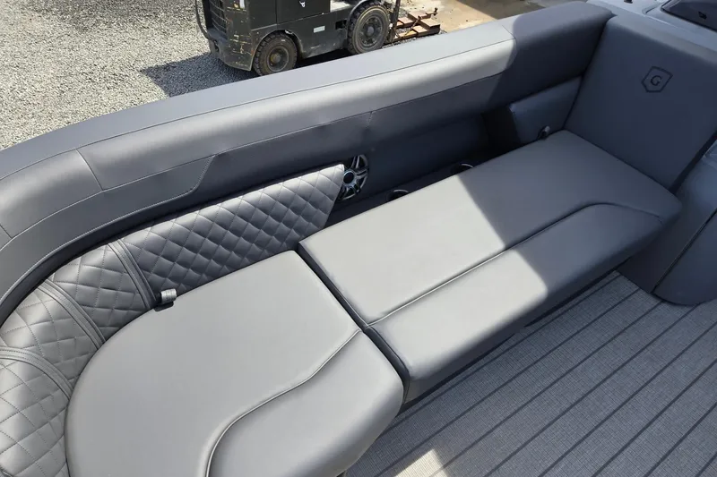 Slide: The Image of 2026 Godfrey SWEETWATER 2286 SB boat interior with gray cushioned seating and quilted design. - 14