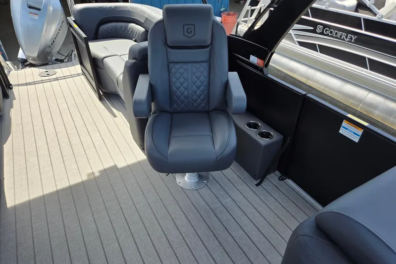 Slide: The Image of Luxurious seating on 2026 Godfrey SWEETWATER 2286 SB pontoon boat interior. - 18