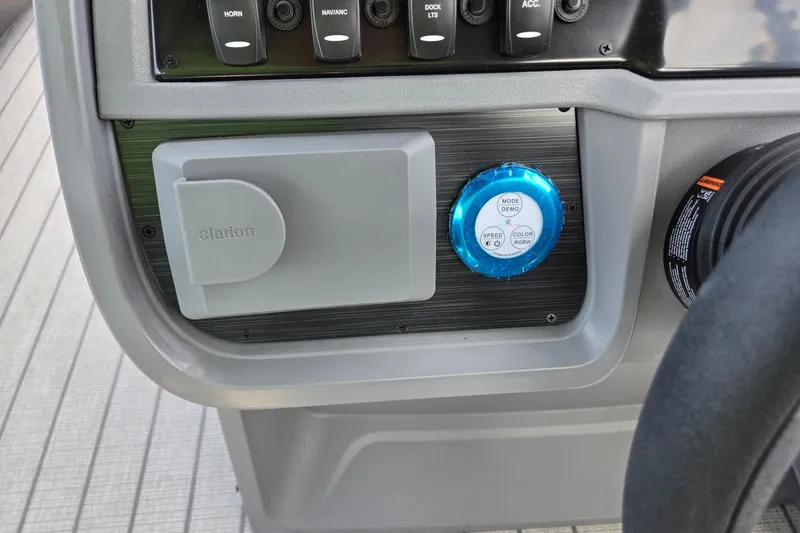 Slide: The Image of 2026 Godfrey SWEETWATER 2286 SB dashboard with Clarion cover and control panel. - 22