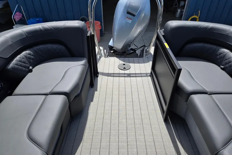 Slide: The Image of 2026 Godfrey SWEETWATER 2286 SB pontoon boat interior with gray seating and motor. - 26