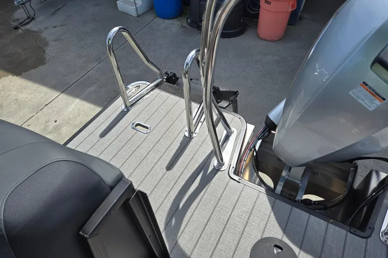 Slide: The Image of 2026 Godfrey SWEETWATER 2286 SB boat deck with ladder and motor. - 29