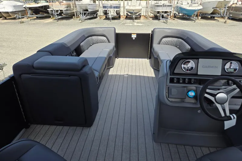 Slide: The Image of 2026 Godfrey SWEETWATER 2286 SB pontoon boat interior with modern seating and Garmin dashboard. - 35