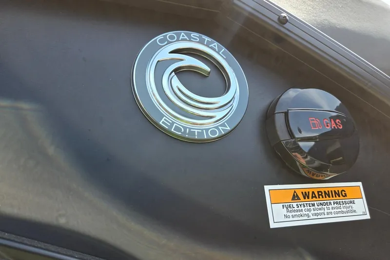 Slide: The Image of 2026 Godfrey SWEETWATER 2286 SB Coastal Edition emblem and gas cap with warning label. - 43
