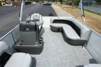 Slide: The Image of 2026 Sun Tracker Bass Buggy 16 DLX pontoon boat with spacious seating and modern design. - 3