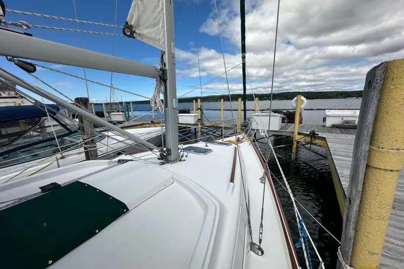 Slide: The Image of Beneteau Oceanis 36 CC sailboat docked at a marina, 2000 model. - 12