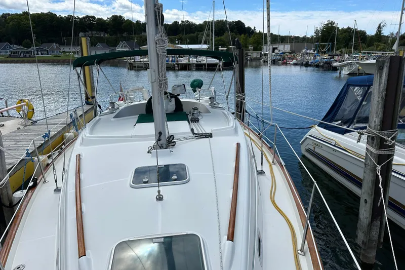 Slide: The Image of Beneteau Oceanis 36 CC sailboat docked at marina, 2000 model, scenic waterfront view. - 15